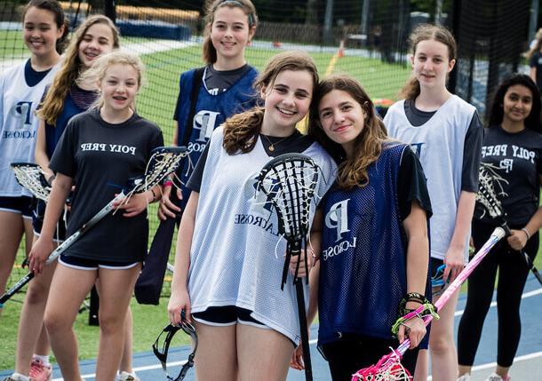 Poly Prep Middle Schoolers learning to play lacrosse